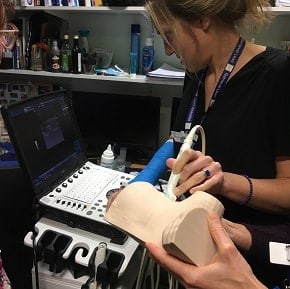 Pediatric doctor simulates on a chest drain trainer